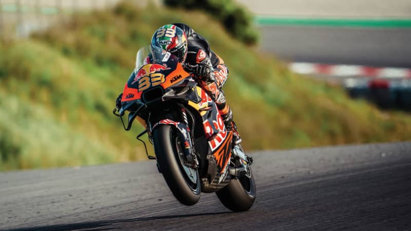 Brad Binder lifts the front wheel of his KTM in 2023 MotoGP testing at Portimao