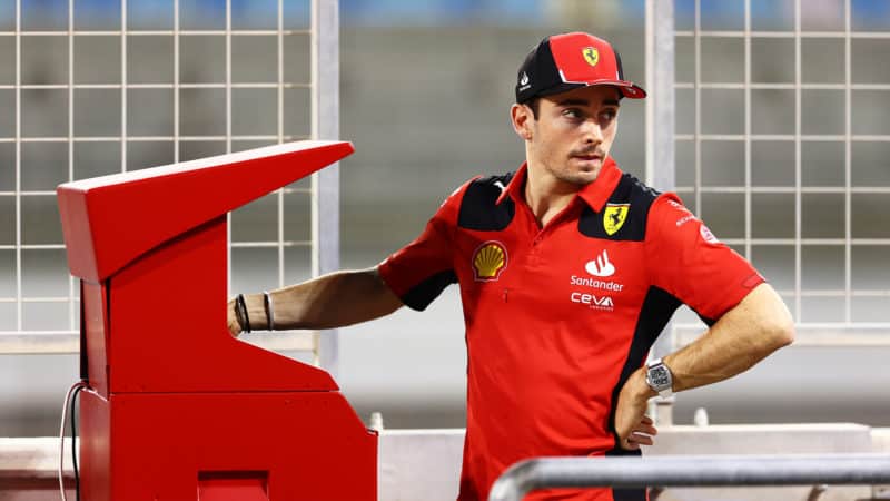 Charles Leclerc with stern look on Ferrari pitwall at 2023 Bahrain Grand Prix