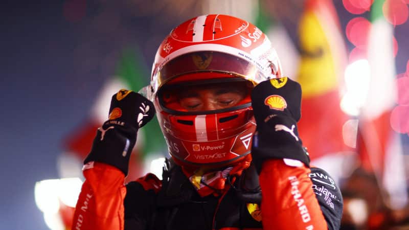 Charles Leclerc holds his arms up after winning 2022 Bahrain Grand Prix