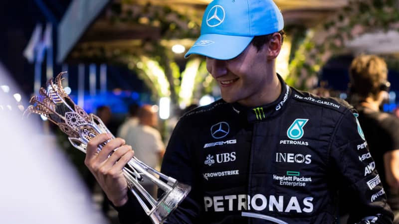 George Russell with third-place trophy from the 2023 Saudi Arabian Grand Prix