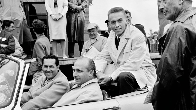 Jack Brabham at the wheel with Juan Fangio and Tonino
