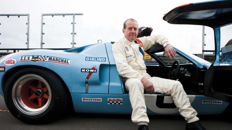 Jackie Oliver sits in Ford GT