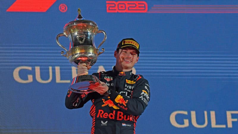 Max Verstappen holds trophy after winning the 2023 F1 Bahrain Grand Prix