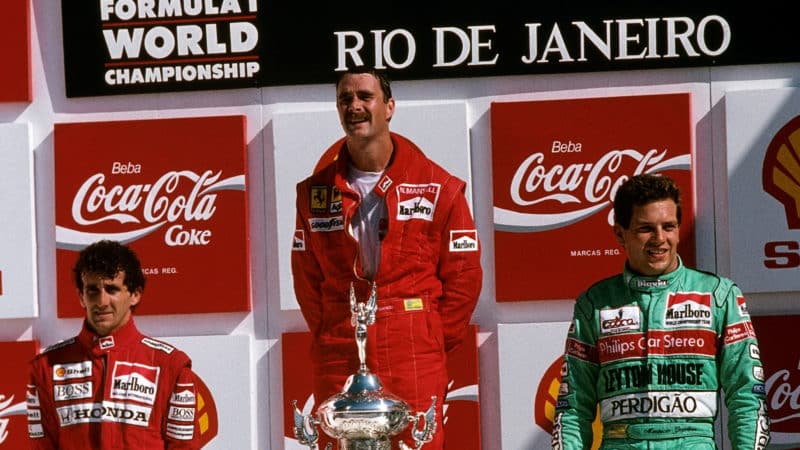 Nigel Mansell on the top of the podium after wiunning 1989 Brazilian Grand Prix
