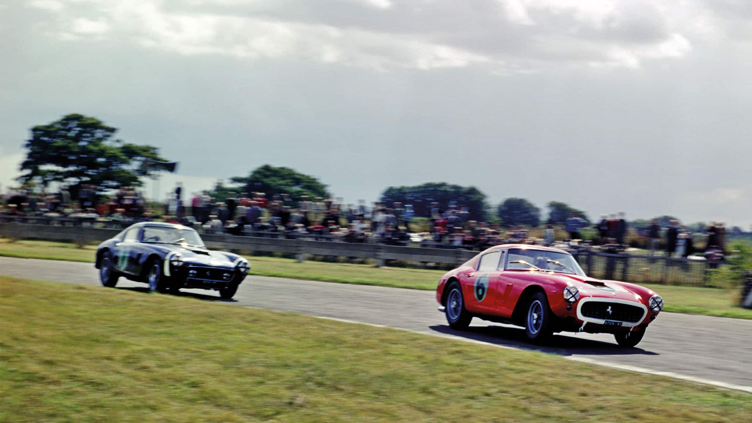 Parkes battles Moss at Goodwood