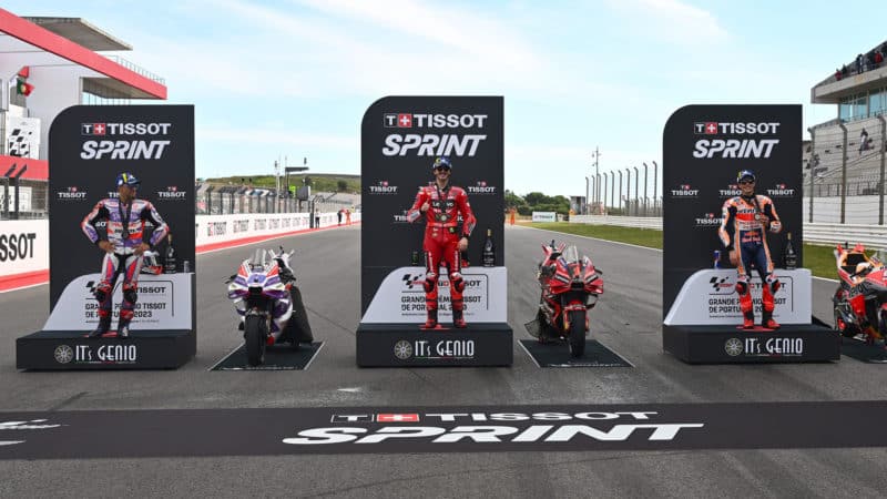 Riders on MotoGP sprint race podium at the end of Portuguese GP