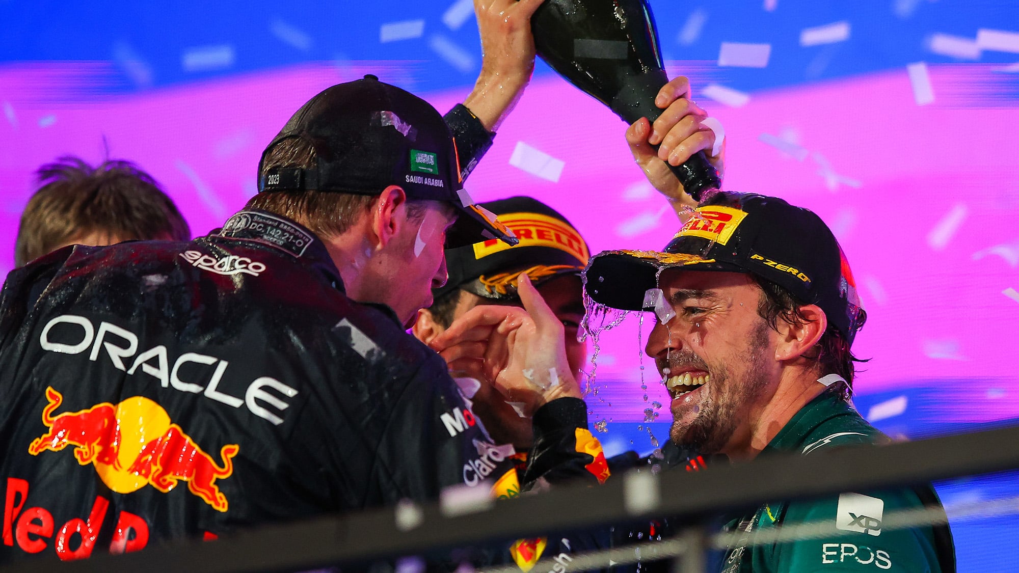 Sergio Perez pours champagne on Fernnado Alonso on the 2023 F1 Saudi Arabian GP podium