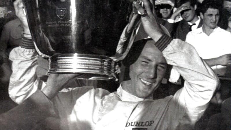 Stirling Moss happy with large trophy