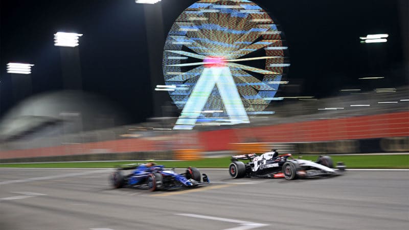 Williams of Logan Sargeant battles alongside Yuki Tsunoda AlphaTauri in the 2023 Bahrain GP
