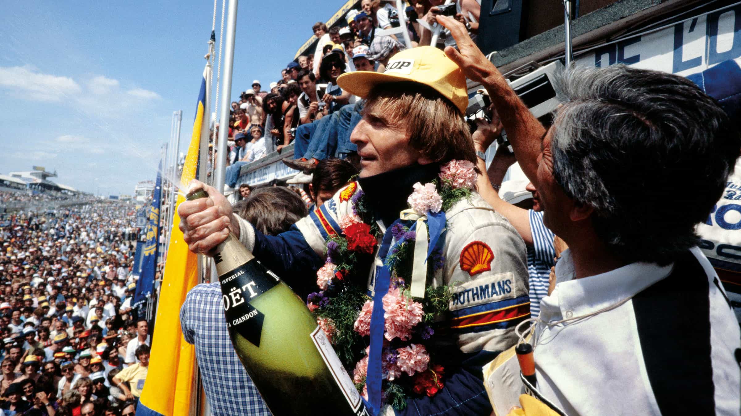 Derek Bell sprays champagne