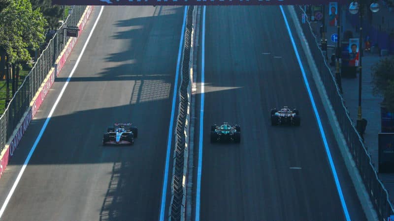 F1 cars on both sides of parallel track at Baku City Circuit