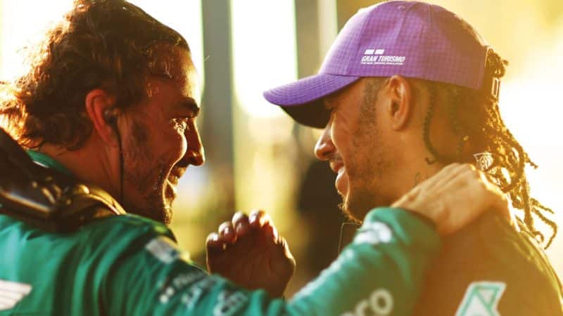 Fernando Alonso and Lewis Hamilton embrace