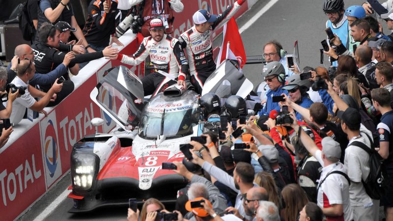 Fernando Alonso’s and Sébastien Buemi celebrate after winning Le Mans in 2018