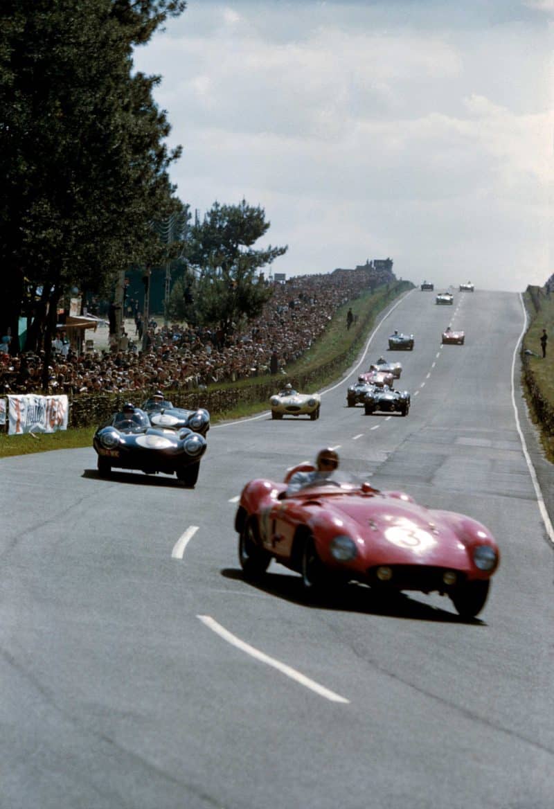 Ferrari 735 LM driven by Umberto Maglioli:Phil Hill leads Jaguar D-type of Don Beauman:Norman Dewis