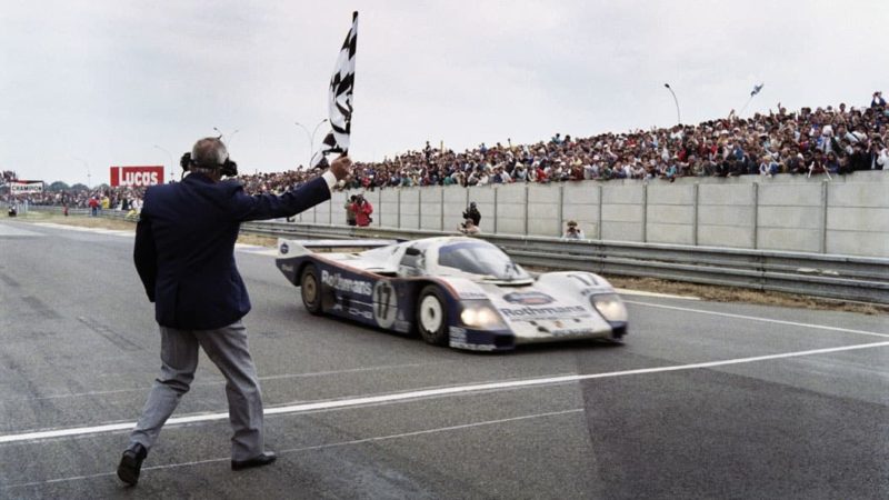 Hans Stuck crossing the line in the Porsche 962C