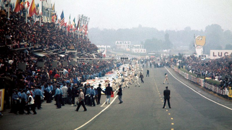 Jacky Ickx walks toward his Ford GT40 at the start in 1969