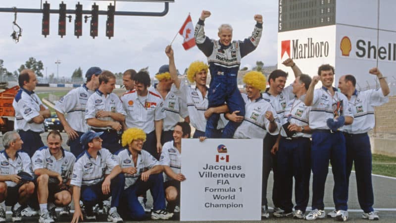 Jacques Villeneuve and Williams team celebrate winning 1997 F1 World Championship