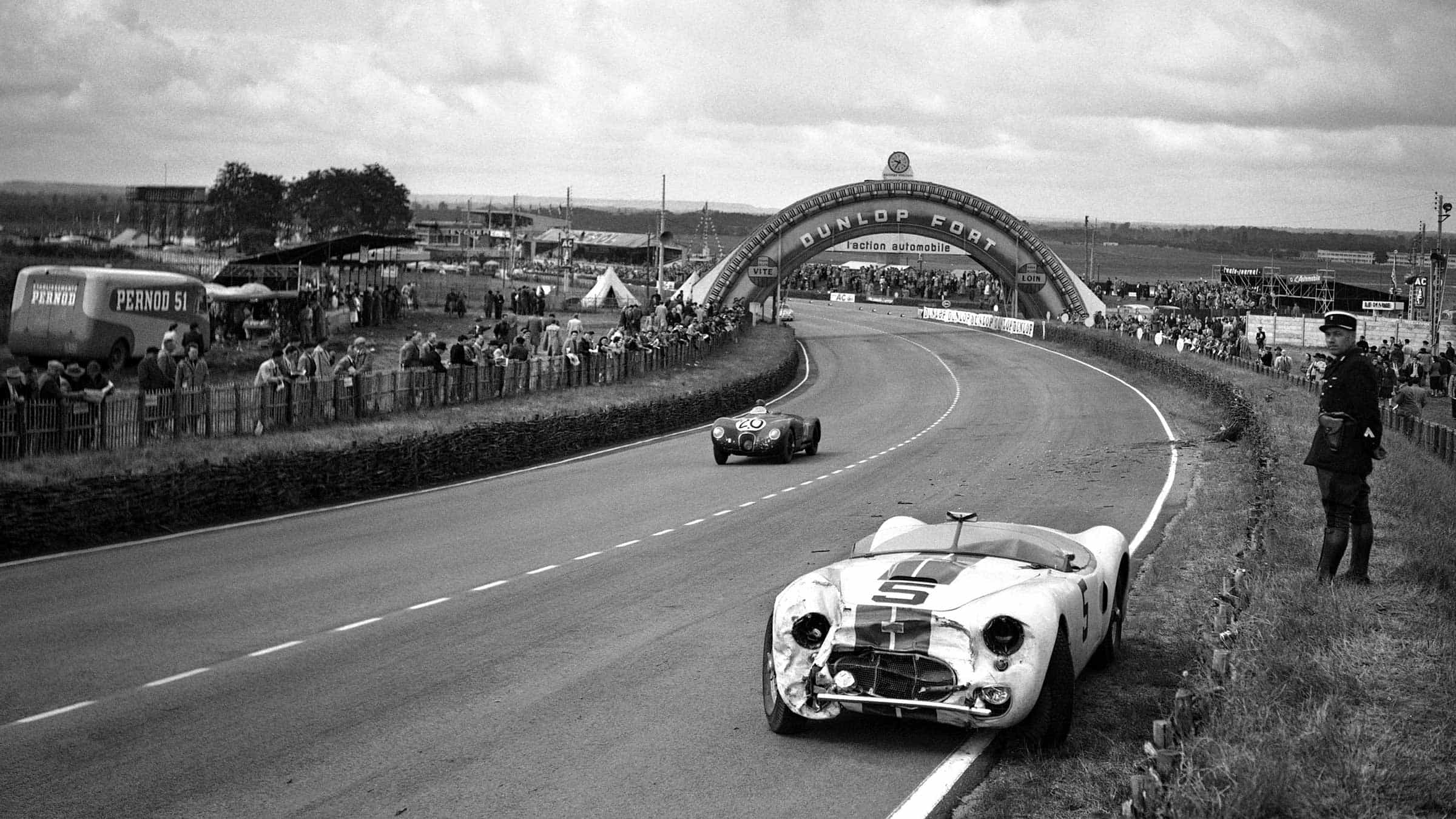 Jaguar C-type passes the crashed Cunningham C-2R