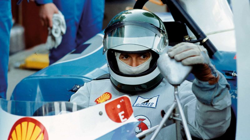 Jean-Pierre Jarier fiddles with a mirror on his Matra in 1974