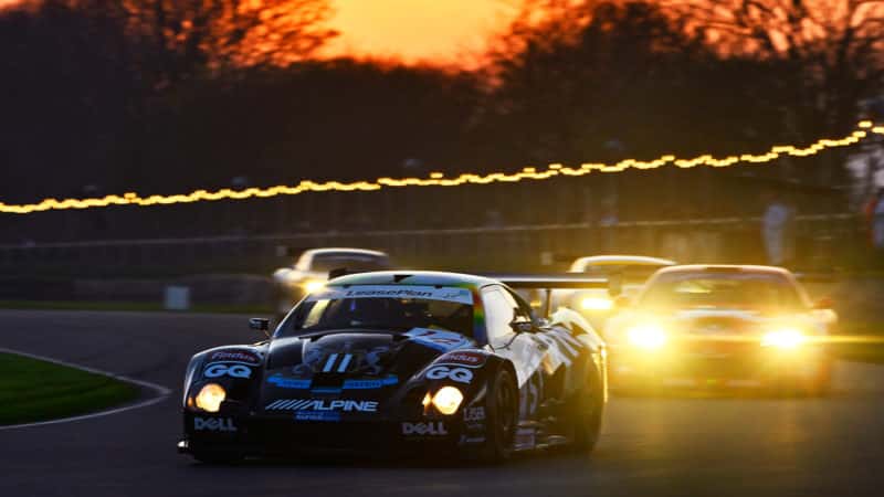Lister Storm leads GT1 cars at night at Goodwood Members Meeting