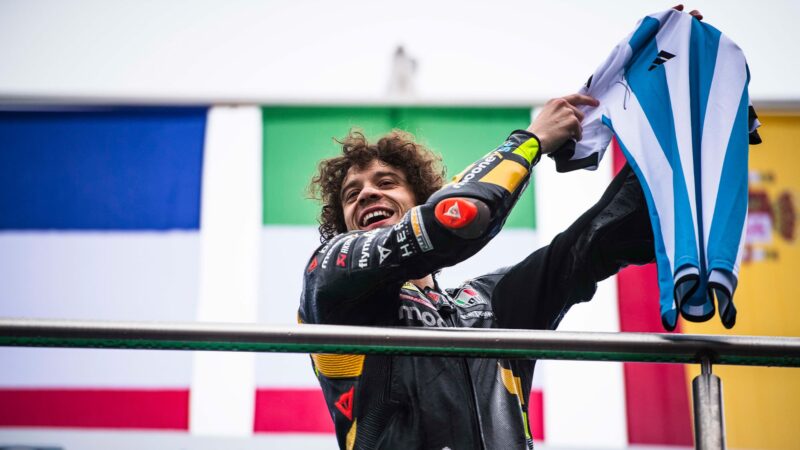 Marco Bezzecchi holds Argentine football shirt on MotoGP podium