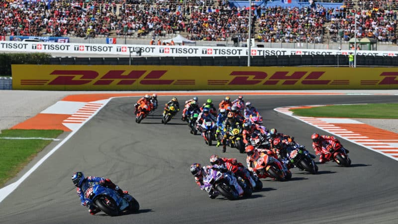 MotoGP riders in a pack at the 2022 Valencia Grand Prix