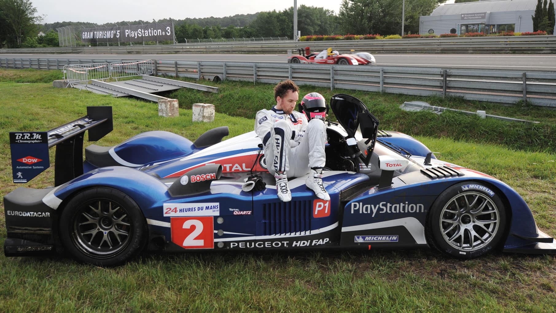 Peugeot's out on the grass at Le Mans