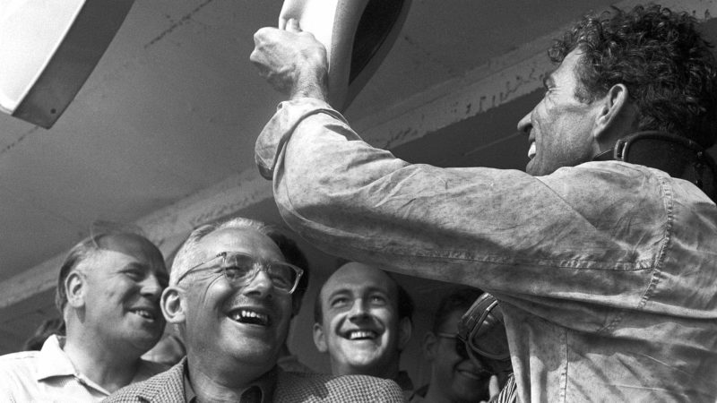 Reg Parnell, David Brown and Carroll Shelby in the pits