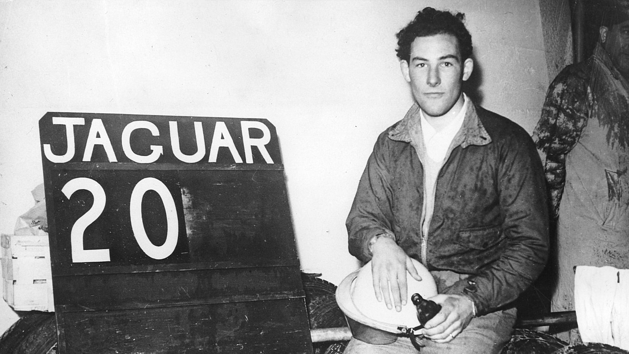 Stirling Moss with Jaguar pit sign at Le Mans in 1951