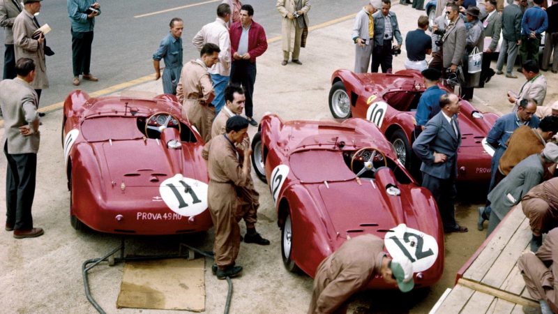 The Ferrari team lined up in the pits ahead of the 1956 race