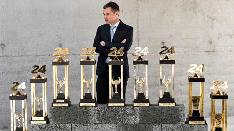 Tom Kristensen poses with his nine winner’s trophies