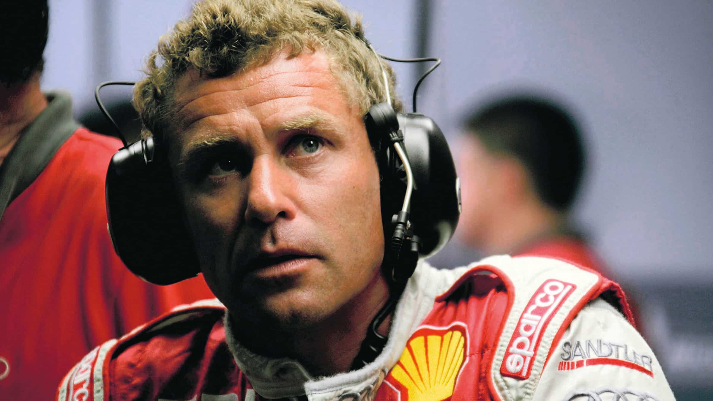 Tom Kristensen wearing headphones