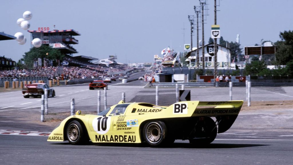 Yellow Porsche 917 on track at Le mans