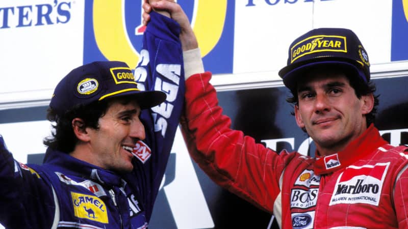 Ayrton Senna raises arm of Alain Prost on podium after 1993 Australian Grand Prix