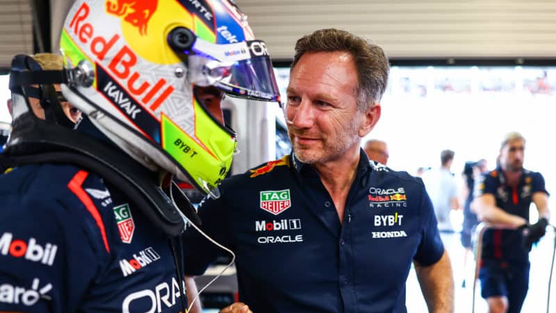 Christian Horner talks to Sergio Perez in Red Bull garage during 2023 F1 Miami GP qualifying