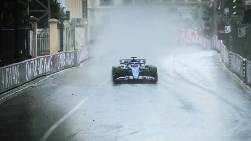 Esteban Ocon surrounded by spray in 2023 Monaco Grand Prix