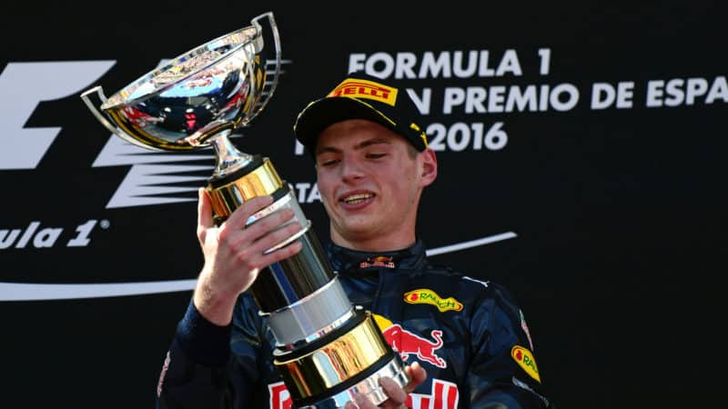 Max Verstappen holds winning trophy from debut victory at the 2016 Spanish GP
