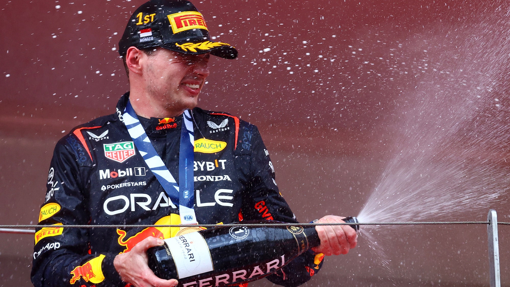 Max Verstappen sprays champagne after 2023 Moanco GP