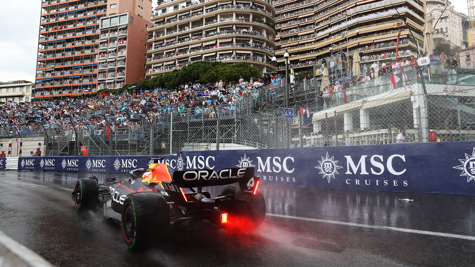 Rear view of Red Bull of Max Verstappen in wet 2023 Monaco GP