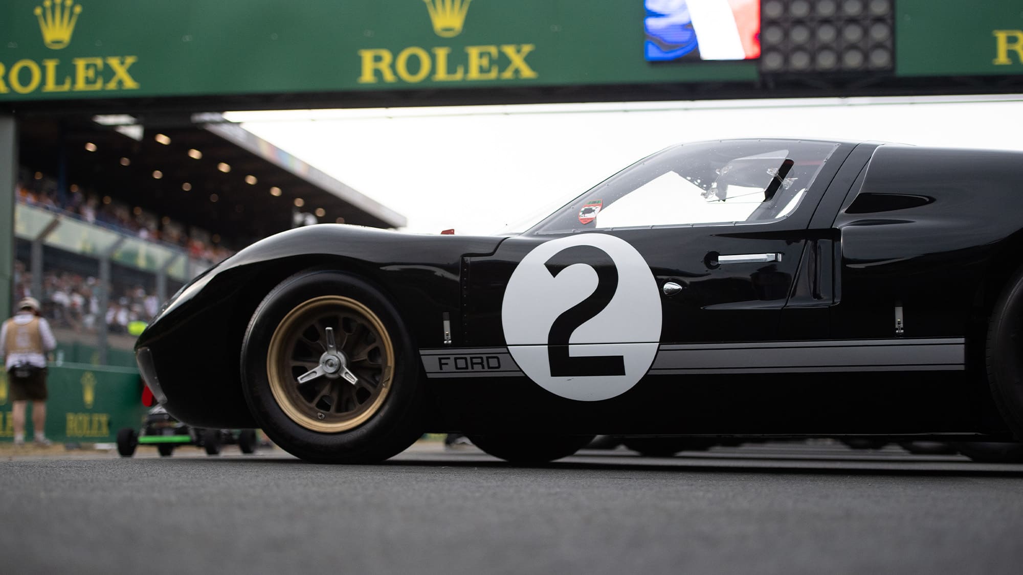 Black and gold Ford GT40 at Le Mans 2023 centenary parade