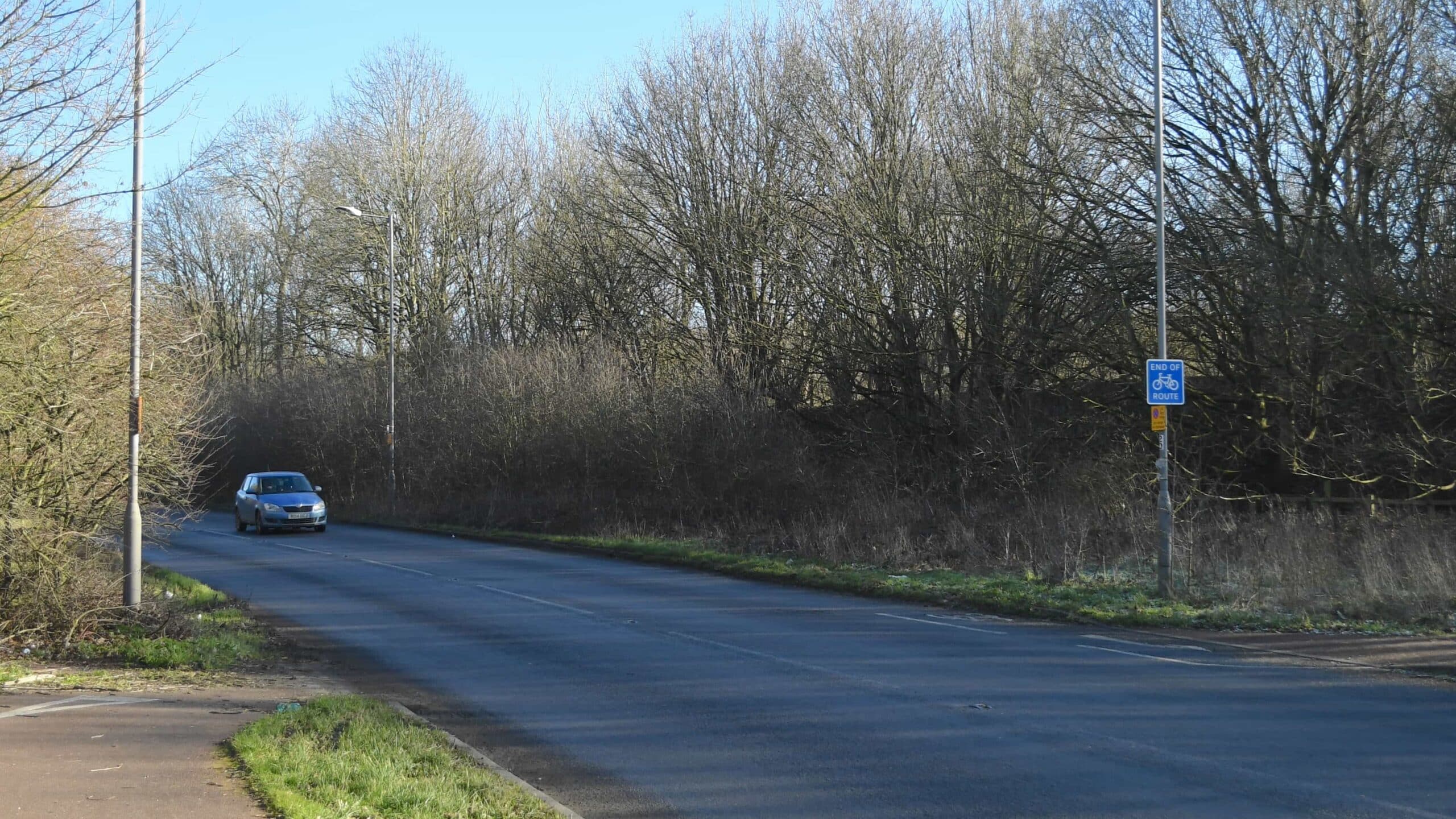 Car drives down the road