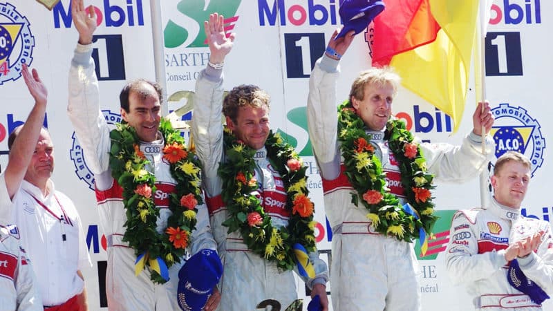 Emmanuele Pirro with Tom Kristensen and Frank Biela on Le Mans podium in 2000
