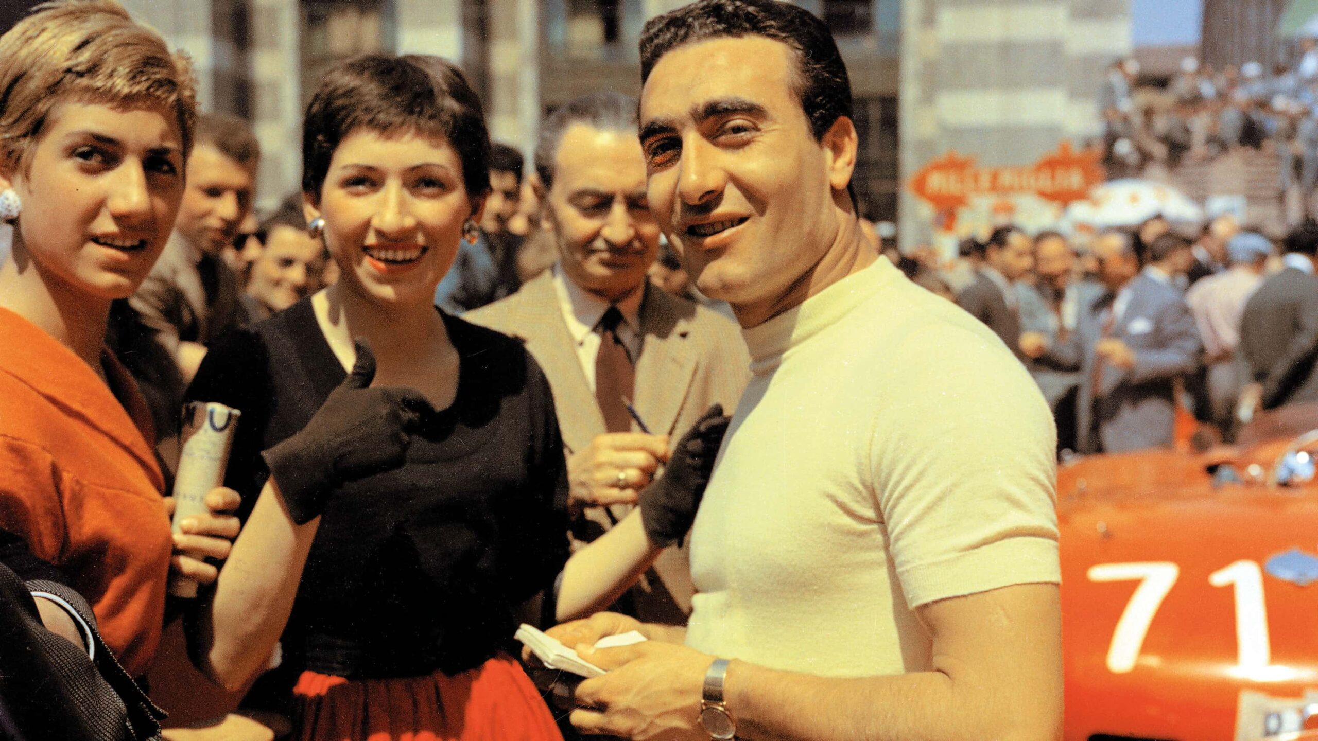 Eugenio Castellotti in 1955 race with fans
