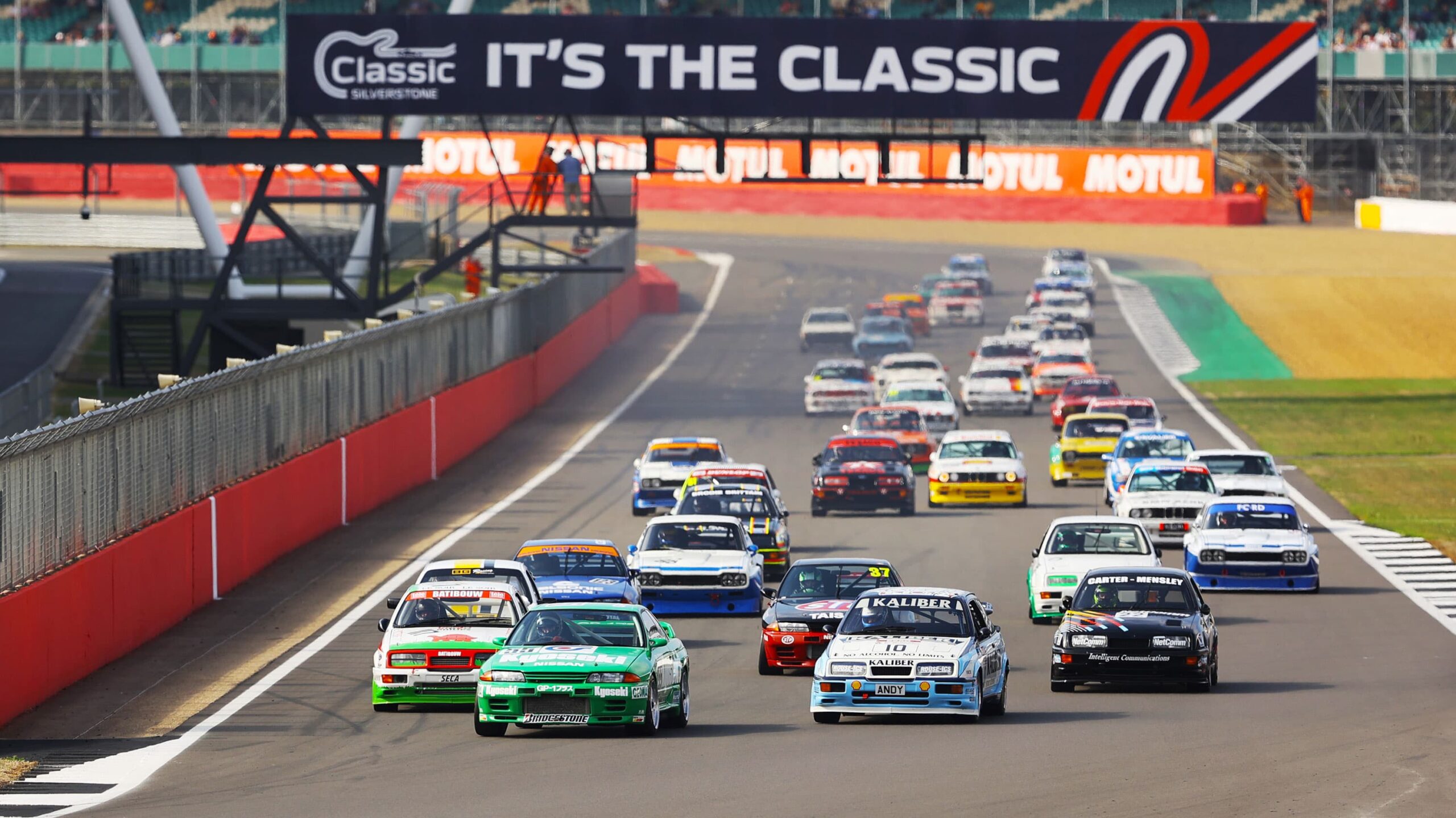Large grid of old classic cars at Silverstone