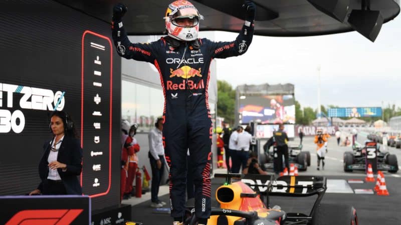 Max verstappen stands on care after Barcelona 2023 victory
