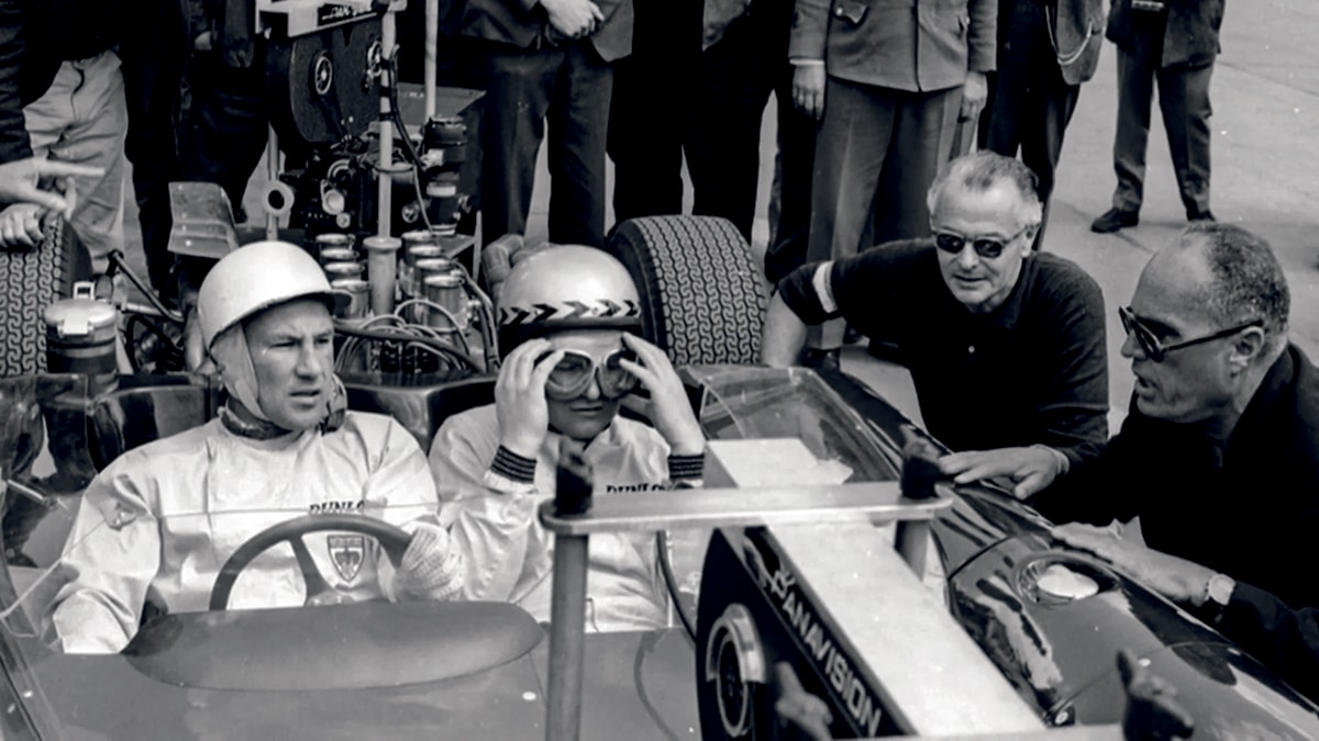Moss aboard the modified Lola T70 camera car