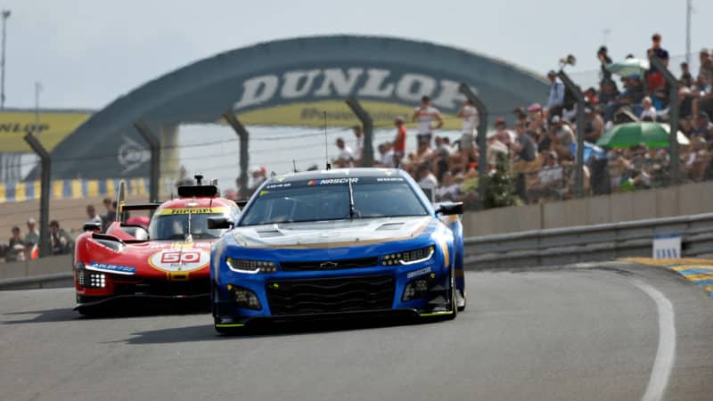 NASCAR Garage 56 car in front of Dunlop Bridge at 2023 Le Mans 24 Hours
