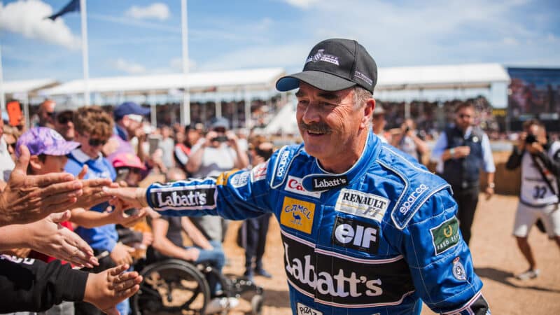 Nigel Mansell high-fives fans at 2022 Goodwood Festival of speed