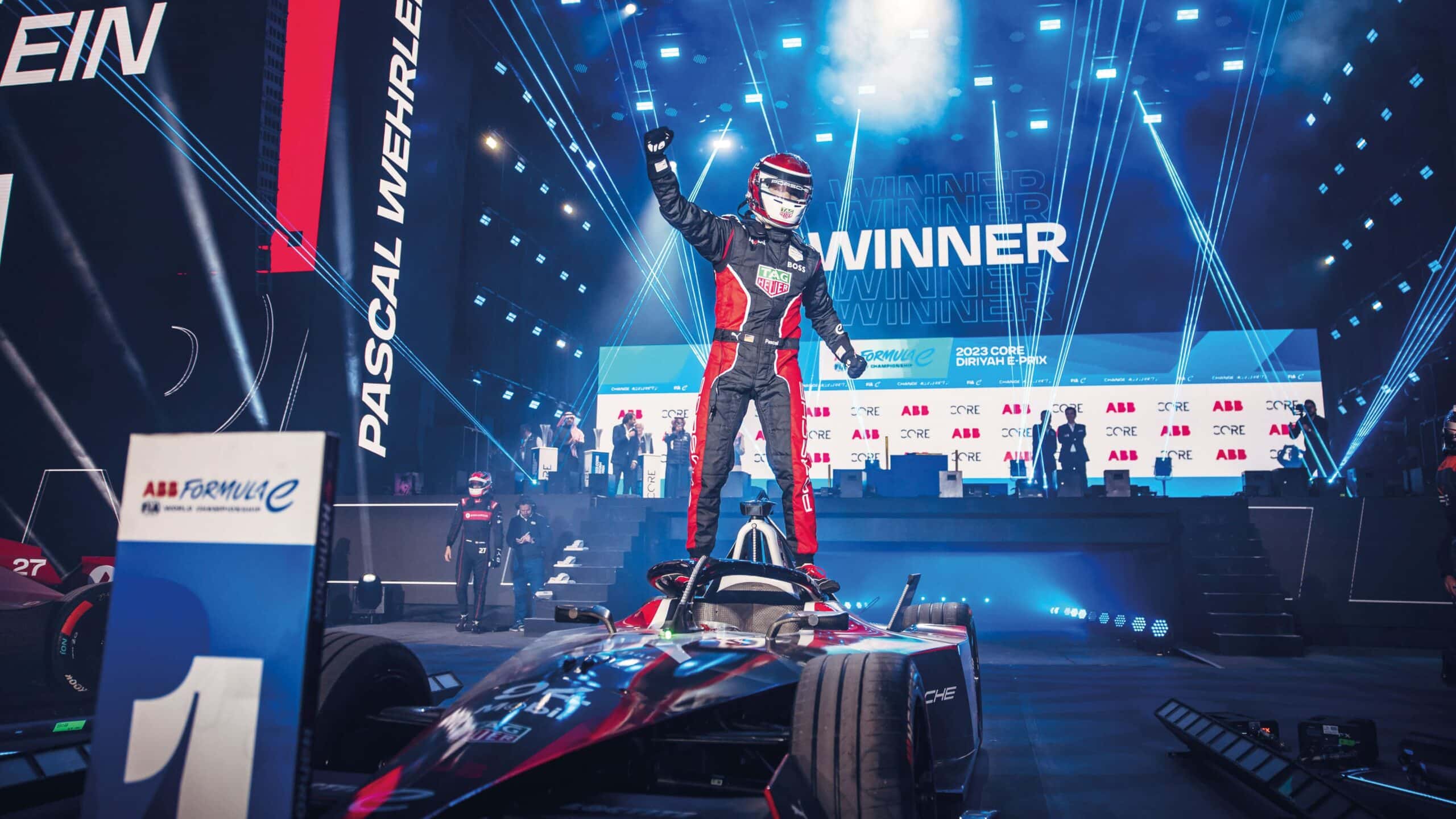 Porsche’s German driver Pascal Wehrlein stand on FE car
