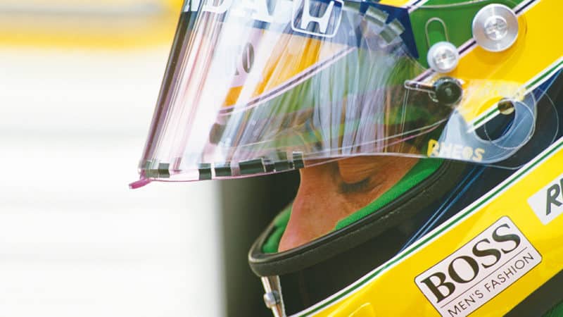 Senna in helmet, side profile pic